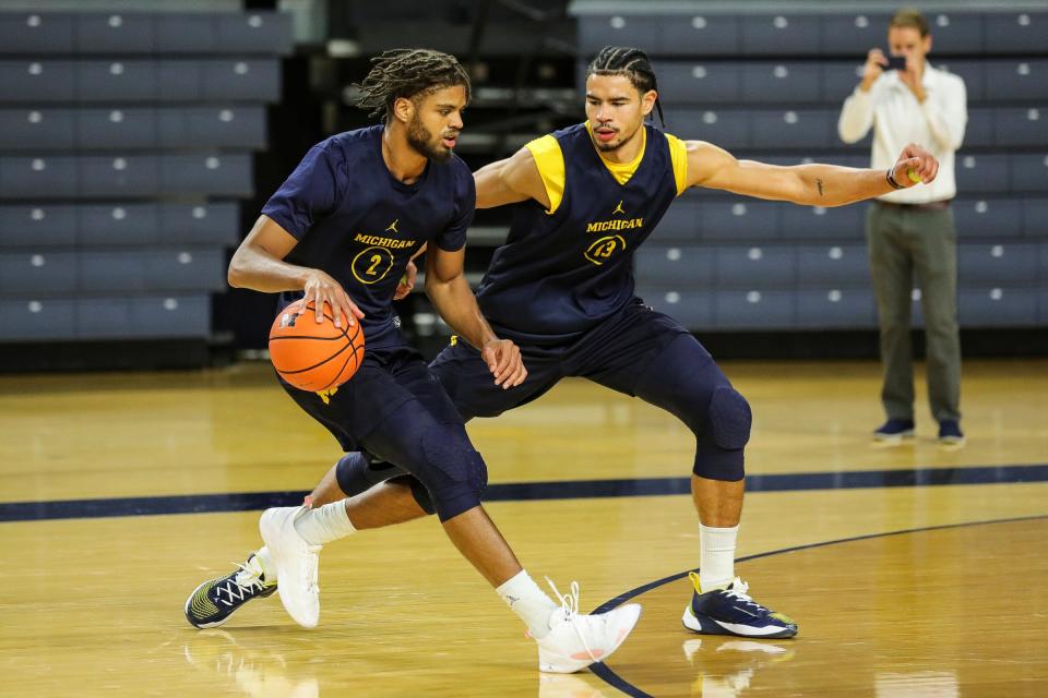 Michigan forward Tray Jackson practices with forward Olivier Nkamhoua during media day at Crisler Center in Ann Arbor on Tuesday, Oct. 17, 2023.
