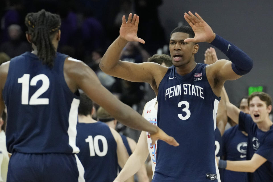 Penn State forward Kebba Njie, right, celebrates with guard Evan Mahaffey after Penn State defeated Northwestern 68-65 during in an NCAA college basketball game in Evanston, Ill., Wednesday, March 1, 2023. (AP Photo/Nam Y. Huh)
