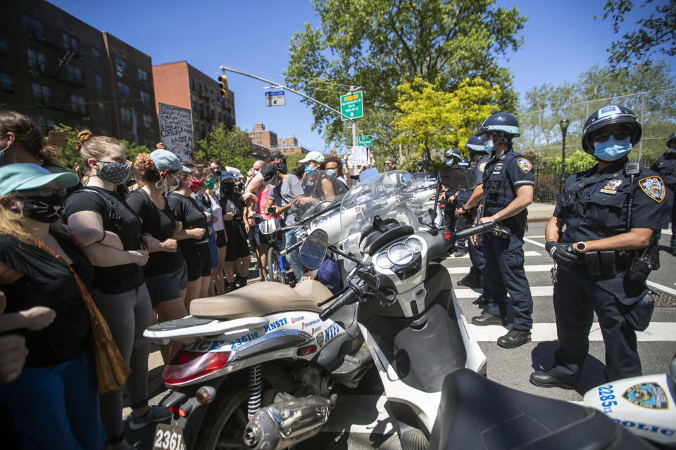 Protesters confront police blocking there access to the FDR Drive during a solidarity rally for George Floyd, Saturday, May 30, 2020, in New York. Floyd died after Minneapolis police officer Derek Chauvin pressed his knee into his neck for several minutes even after he stopped moving and pleading for air. (AP Photo/Mary Altaffer)