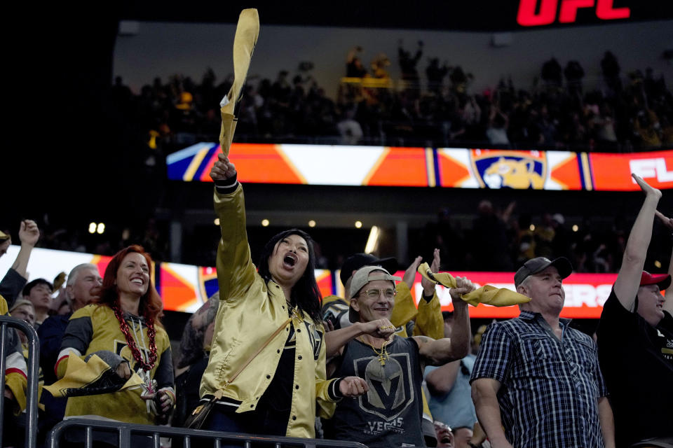 FILE - Vegas Golden Knights fans cheer after a Golden Knights goal against the Florida Panthers during the third period of Game 1 of the NHL hockey Stanley Cup Finals, June 3, 2023, in Las Vegas. The Golden Knights plan to parade this weekend with the NHL Stanley Cup beneath the glittery marquees of the Las Vegas Strip and rally with fans in front of their home arena to mark the team's league championship victory. (AP Photo/John Locher)