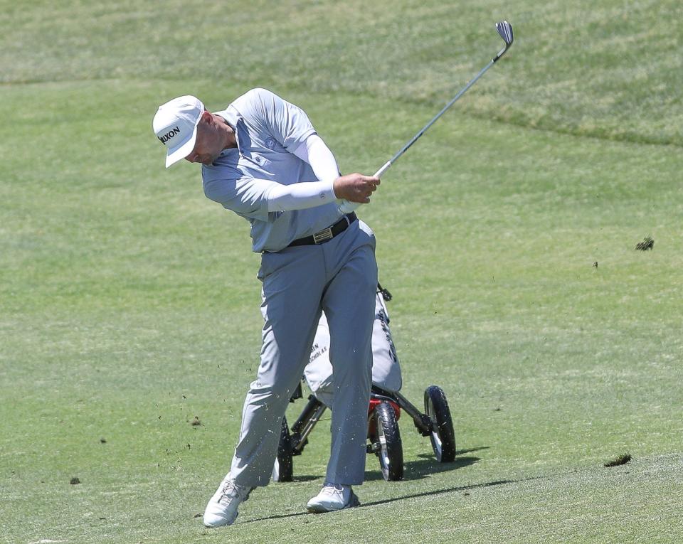Benjamin Nicholas of Yucca Valley hits an approach shot on the first hole of the Grove Course at Indian Ridge Country Club during round one of the U.S. Open local qualifying in Palm Desert, Calif., May 6, 2024.
