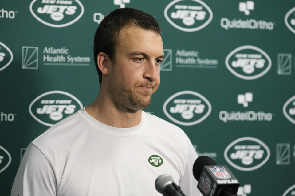 New York Jets quarterback Trevor Siemian (14) gestures during a post game news conference following an NFL football game, Sunday against the Miami Dolphins, Dec. 17, 2023, in Miami Gardens, Fla. The Dolphins defeated the Jets 30-0. (AP Photo/Lynne Sladky)