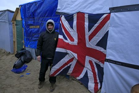 Terer, a migrant from Syria, shows a Union Jack sleeping bag used as a door to his shelter in a camp for migrants called the "jungle", near Calais, northern France, February 21, 2016. REUTERS/Pascal Rossignol