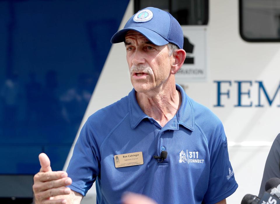 Sarasota County Commissioner Ron Cutsinger talks to the media after visiting with survivors of Hurricane Ian's flood and wind damage on Saturday Oct.15, 2022 in North Port.