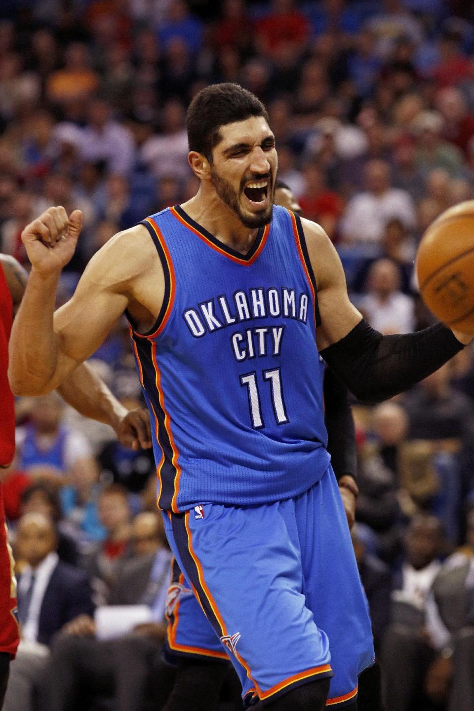 Oklahoma City Thunder center Enes Kanter reacts to his team making a basket against the New Orleans Pelicans during the first half of an NBA basketball game in New Orleans, Wednesday, Dec. 21, 2016. (AP Photo/Max Becherer)