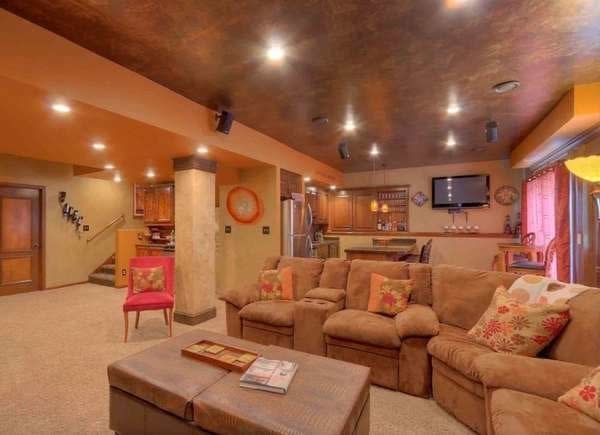 Basement ceiling with copper color and texture and orange-peach walls