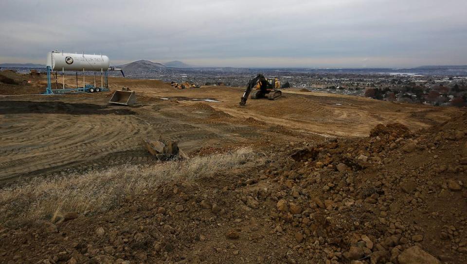 Outlines of new roads and residential lots are being scratched out of the dirt on the west end of the north face of Thompson Hill in Kennewick. 