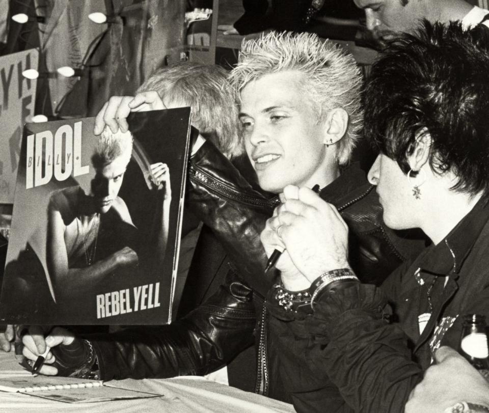 Idol and Steve Stevens signing autographs in Hollywood, 1984. (Credit: Ron Galella/Ron Galella Collection via Getty Images)