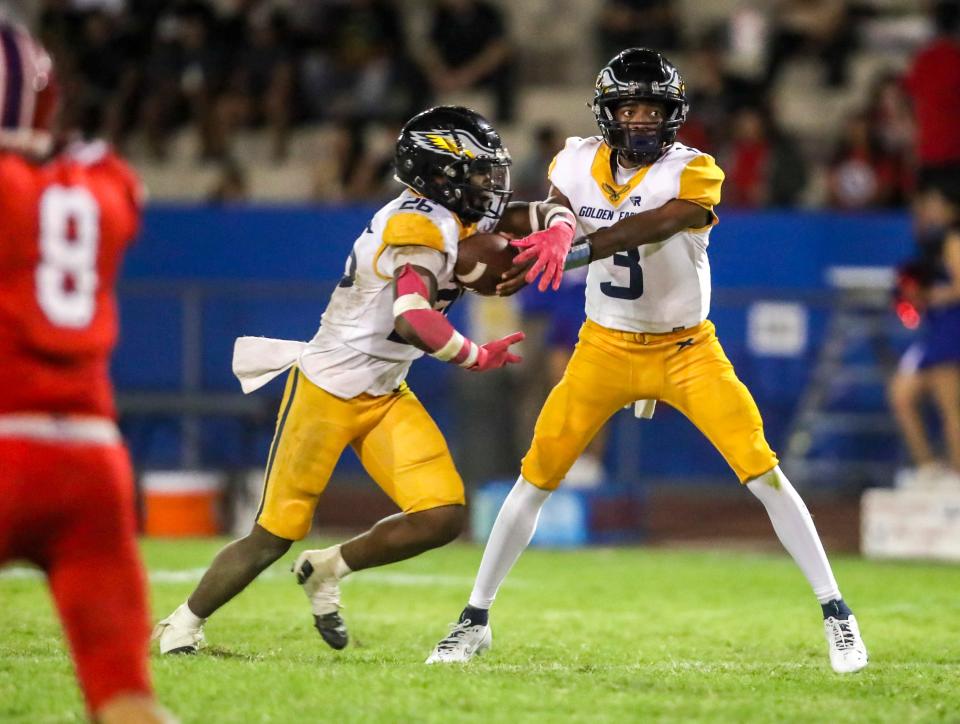 Desert Hot Springs' Messiah Smith (3) makes the handoff to Christian Davis (26) during the fourth quarter of their game in Indio, Calif., Thursday, Sept. 14, 2023.