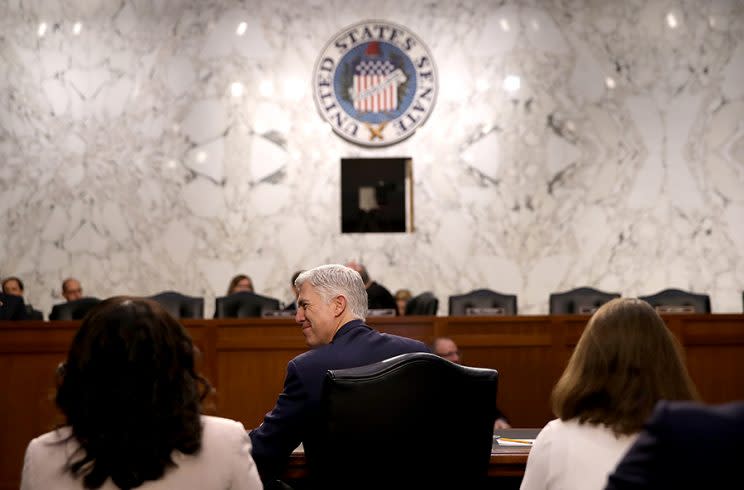 Judge Neil Gorsuch was flanked by women in white during his Senate confirmation hearing on March 22. (Photo by Justin Sullivan/Getty Images)