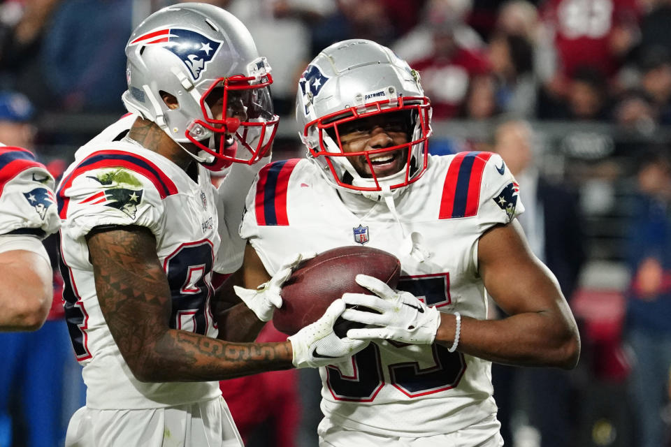 New England Patriots running back Pierre Strong Jr., right, celebrates after scoring a touchdown against the Arizona Cardinals during the second half of an NFL football game, Monday, Dec. 12, 2022, in Glendale, Ariz. (AP Photo/Darryl Webb)