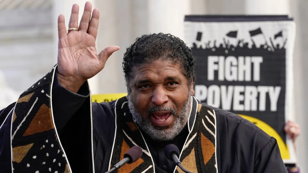 The Rev. William Barber II speaks during a demonstration at the U.S. Supreme Court during the MoveOn and Poor People’s Build Back Better Action event in November 2021. Barber had to leave a movie theater Tuesday in what the civil rights leader said was a dispute over a special chair he uses for a medical condition. (Photo by Jemal Countess/Getty Images for MoveOn)