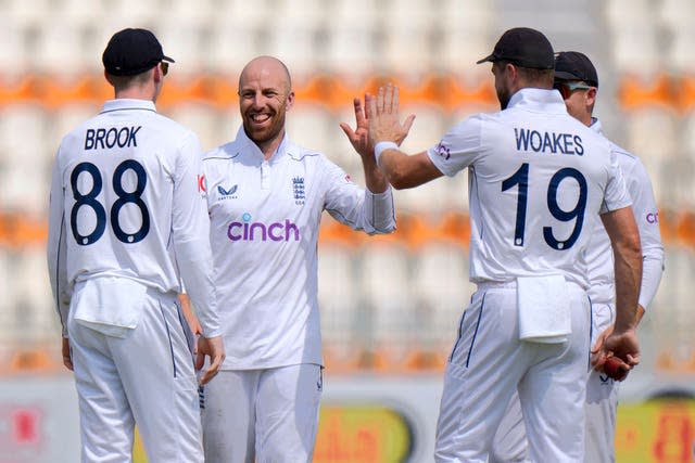 Jack Leach celebrates the wicket of Mohammad Rizwan with his England team-mates