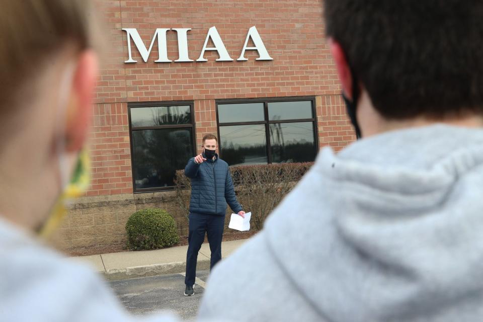 Needham boys volleyball coach Dave Powell Jr. speaks during the rally outside of the MIAA headquarters in Franklin on March 16, 2021. The students gathered to encourage the MIAA to allow spring student-athletes to play in state semifinal and final games before the last Board of Directors meeting on Wednesday.