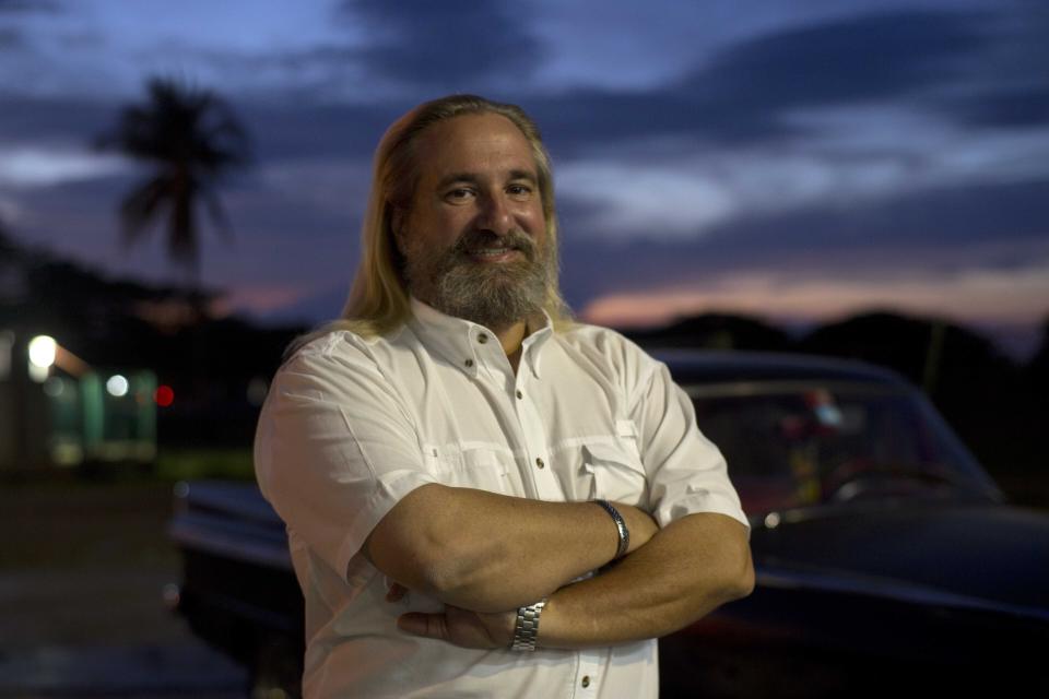 FILE - Fernando Gonzalez poses for a portrait in Havana, Cuba, March 5, 2014. Gonzalez, 60, who spent decades covering and directing major stories for The Associated Press across Latin America, died in Havana, Cuba late Sunday, Nov. 21, 2021 when he fell suddenly ill at his home. (AP Photo/Ramon Espinosa, File)