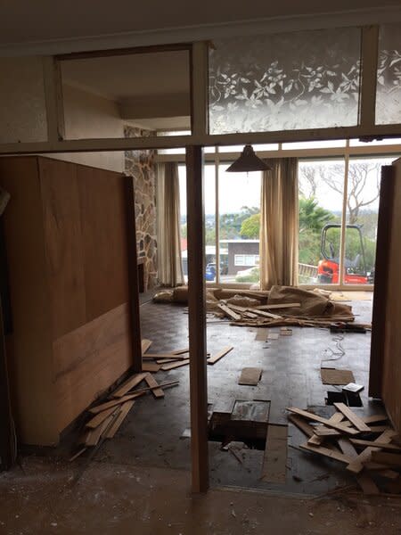 Before: Although it enjoyed great views, the living room was small and separated from the kitchen and dining room.