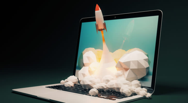 graphic of cartoon rocket shooting out of laptop computer with black background behind computer, best startups