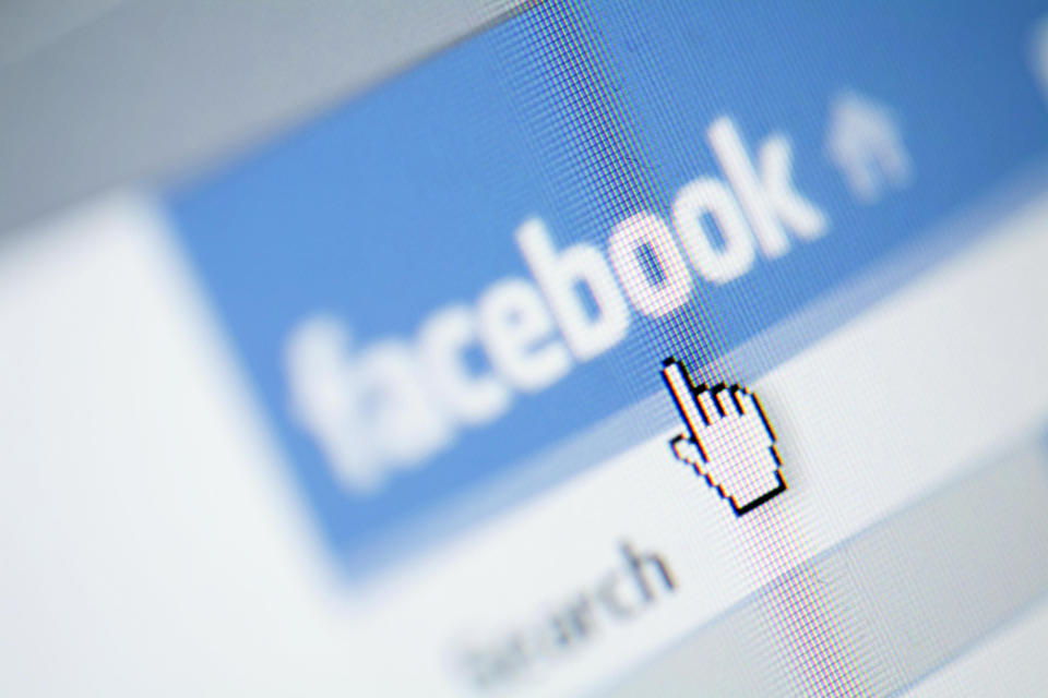 Pictured: Cursor hovering over Facebook logo. Image: Getty