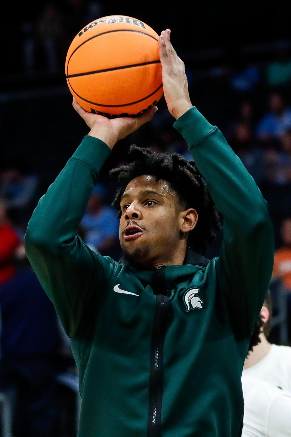Michigan State guard A.J. Hoggard (11) warms up before the NCAA tournament West Region second round against North Carolina at Spectrum Center in Charlotte, N.C. on Saturday, March 23, 2024.
