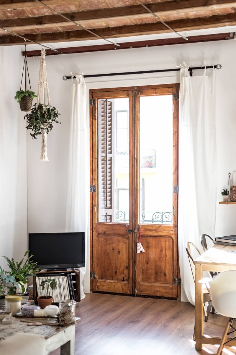 command hooks used to hold curtain rods in place inside farmhouse living room.