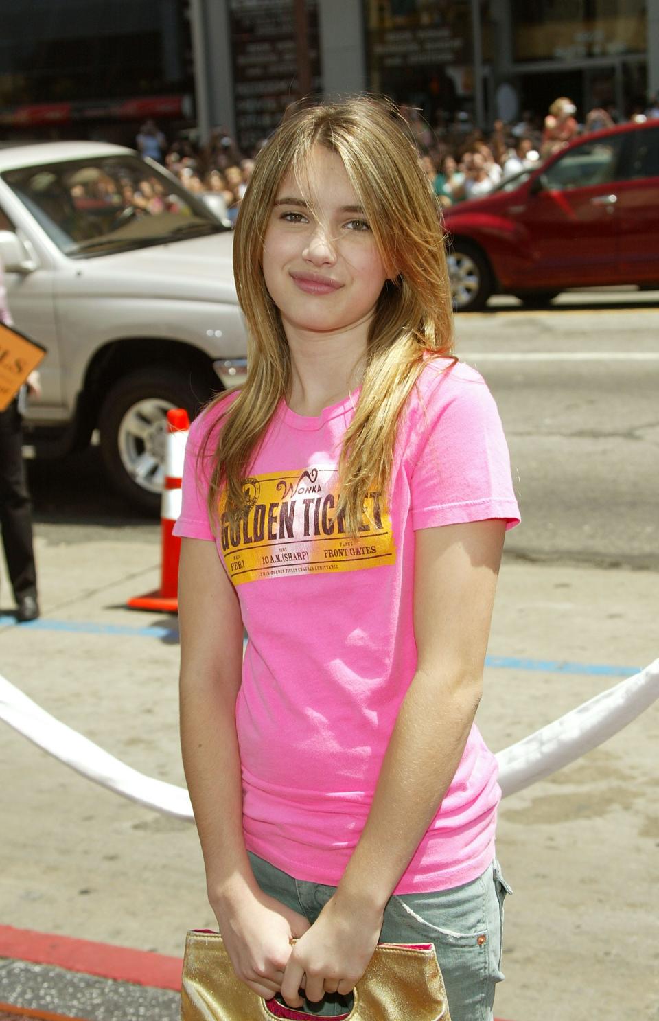 Emma Roberts in a pink t-shirt