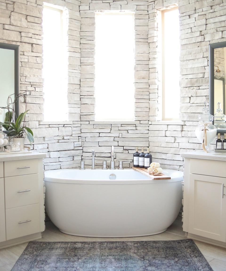 A white brick wall in a bathroom