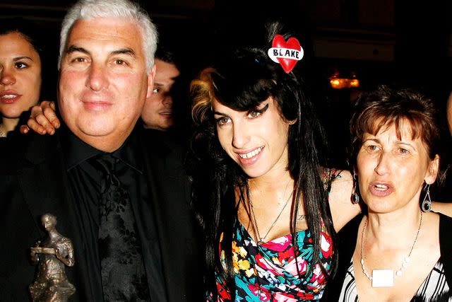 <p>Gareth Davies/Getty</p> From Left: Mitch Winehouse, Amy Winehouse and Janis Winehouse in 2008