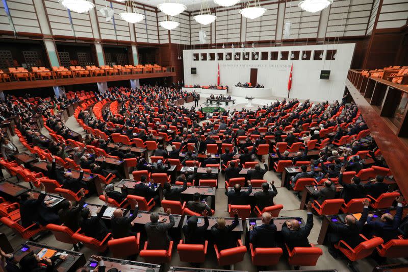 Turkish lawmakers vote a bill that allows troop deployment to Libya, at the Parliament in Ankara