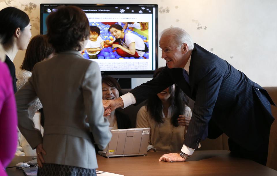 U.S. Vice President Biden meets employees of internet commerce and mobile games provider DeNA Co as he inspects the company headquarters in Tokyo