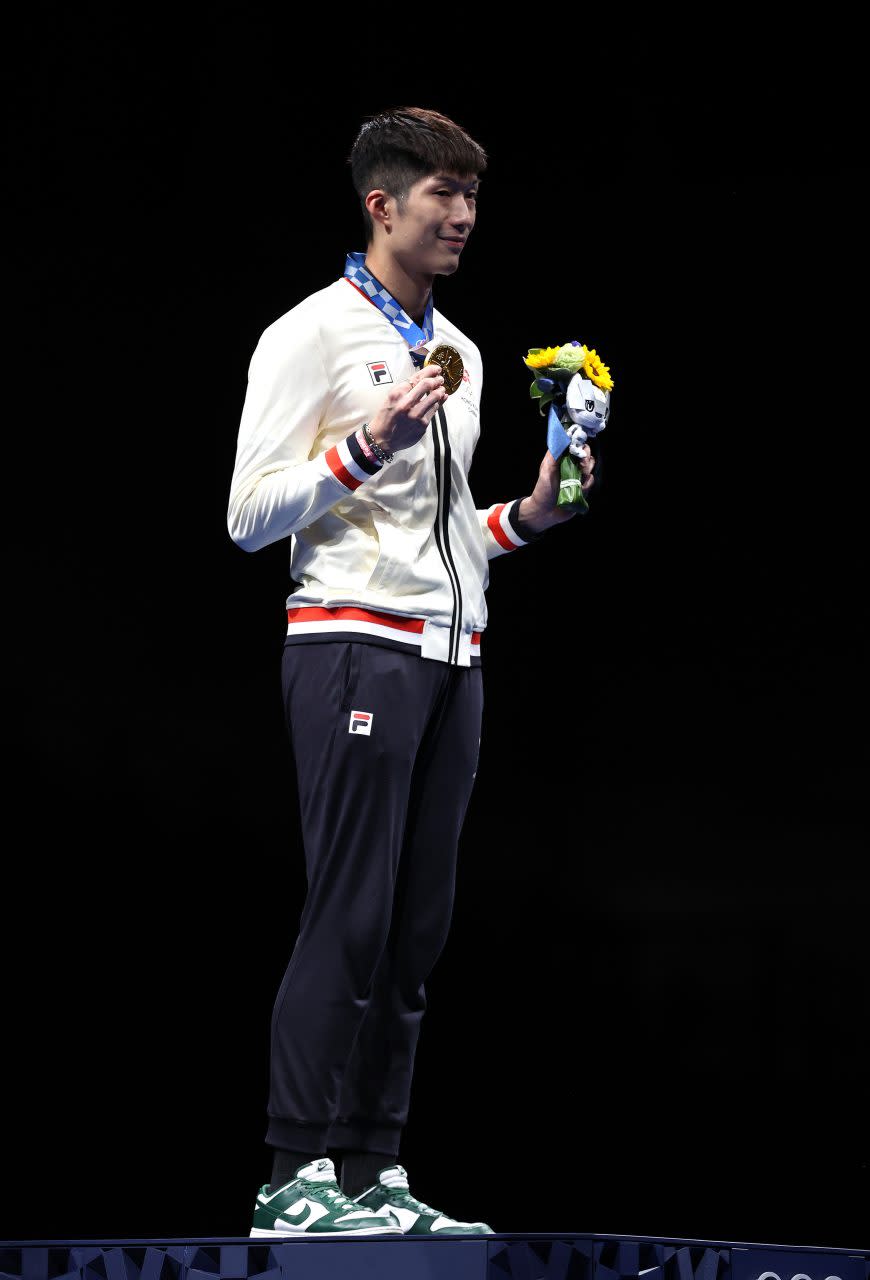 CHIBA, JAPAN - JULY 26: Gold medalist Ka Long Cheung of Team Hong Kong poses on the podium during the medal ceremony for Men's Foil Individual Fencing on day three of the Tokyo 2020 Olympic Games at Makuhari Messe on July 26, 2021 in Chiba, Japan. (Photo by Elsa/Getty Images)