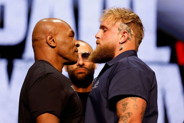<p>Sarah Stier/Getty</p> Mike Tyson and Jake Paul promoting their upcoming boxing match in New York City on May 13, 2024