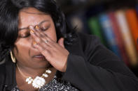 FILE - In this Dec, 15, 2014 file photo, Samaria Rice, of Cleveland, Ohio, mother of Tamir Rice, touches her hand to her face during an interview at The Associated Press, in New York. A Cleveland police officer fatally shot 12-year-old Tamir Rice on Nov. 22 as he played with a toy gun outside a recreation center. The family of 12-year-old Tamir Rice, who was shot and killed by Cleveland police in 2014, asked the Justice Department on Friday to reopen the case into the boy's death after it was closed in the waning weeks of the Trump administration. (AP Photo/Mark Lennihan)
