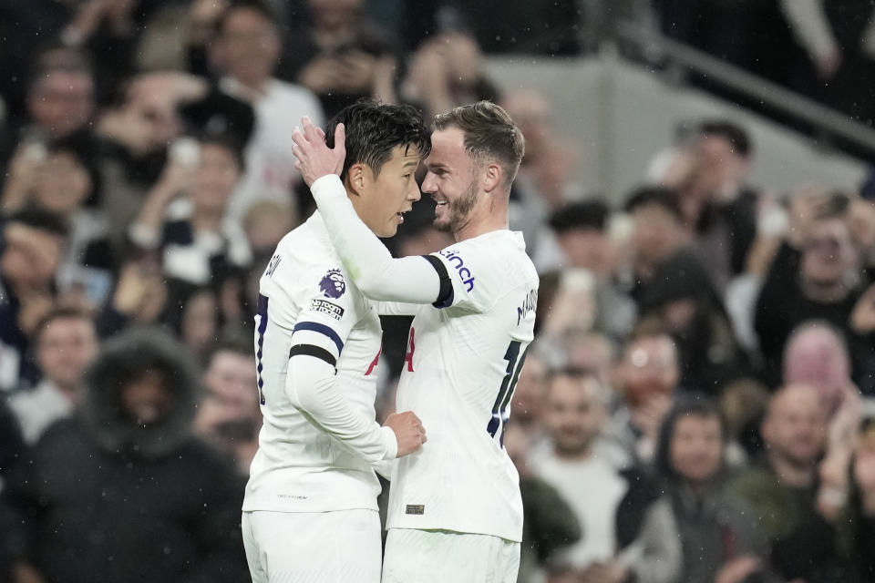 Tottenham's Son Heung-min, left, and Tottenham's James Maddison during the English Premier League soccer match between Tottenham Hotspur and Fulham at the Tottenham Hotspur Stadium in London, Monday, Oct. 23, 2023. (AP Photo/Kin Cheung)