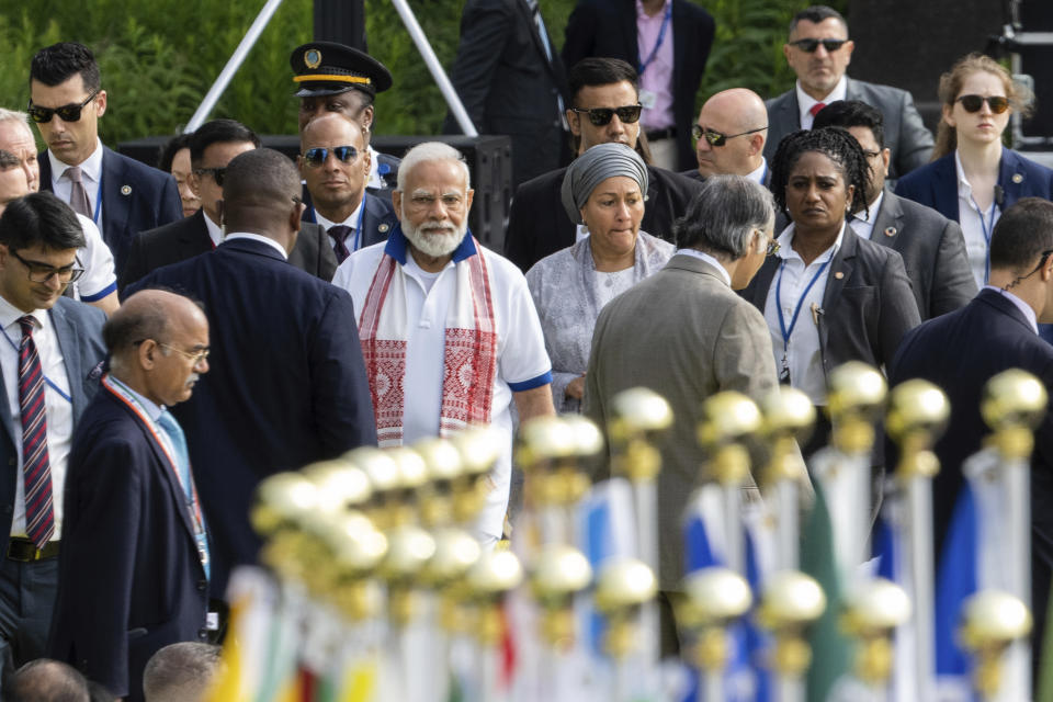 India Prime Minister Narendra Modi, center, arrives during the International Yoga day event at United Nations headquarters, Wednesday, June 21, 2023. (AP Photo/Jeenah Moon)
