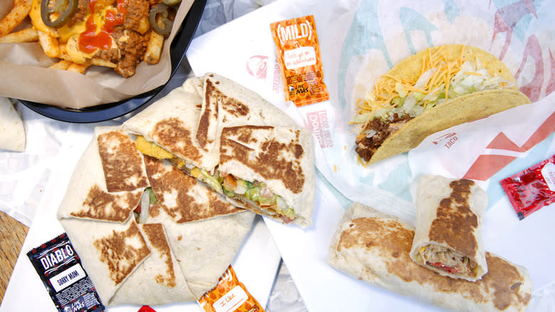 Assortment of Taco Bell food items on branded paper