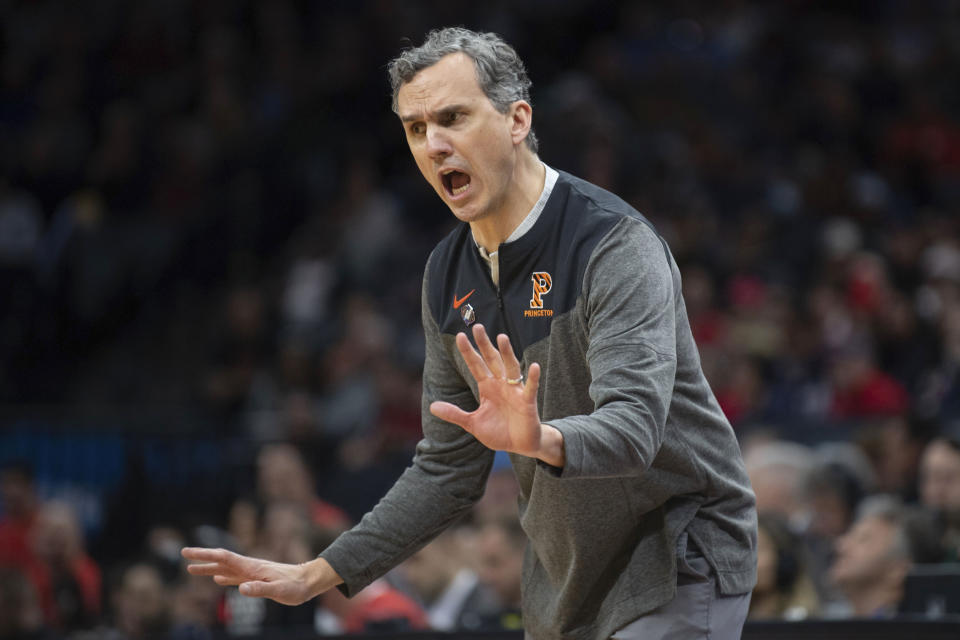 Princeton head coach Mitch Henderson tells his team to slow down the tempo during the first half of a first-round college basketball game against Arizona in the NCAA Tournament in Sacramento, Calif., Thursday, March 16, 2023. Princeton’s upset of Arizona conjured up memories of what the Tigers achieved in the 1990s when current coach Mitch Henderson was a player. Instead of going down memory lane, Henderson wants to make sure the focus is on what this group of players is accomplishing. (AP Photo/José Luis Villegas)