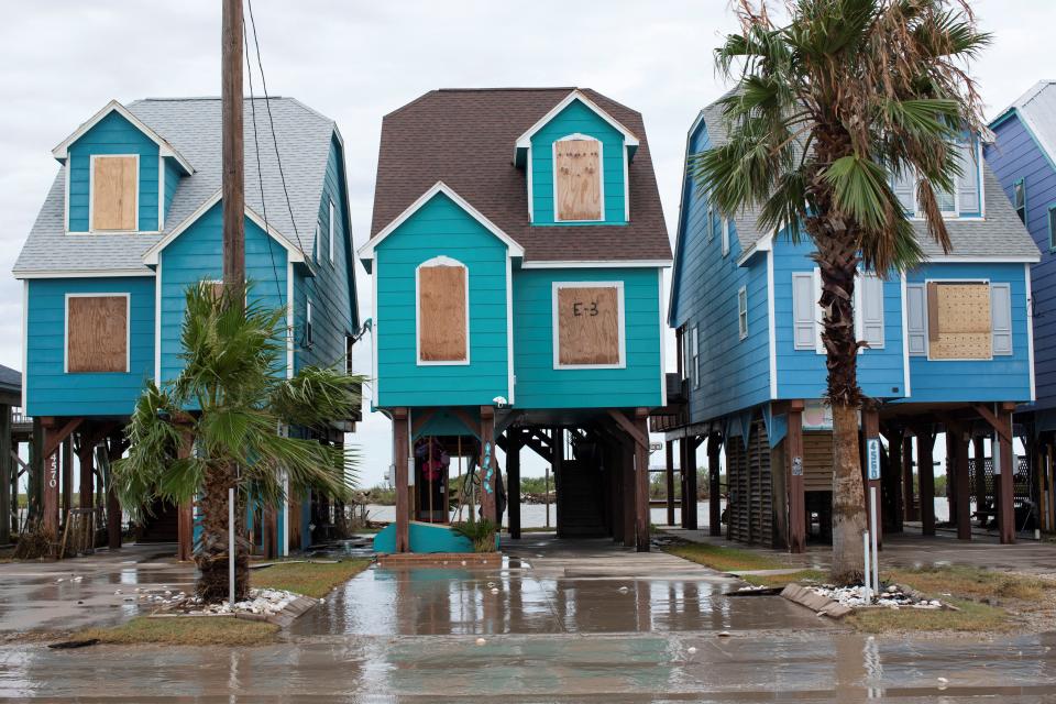 Buildings stand surrounded by debris after the storm surge from Hurricane Beryl receded Monday in Matagorda.