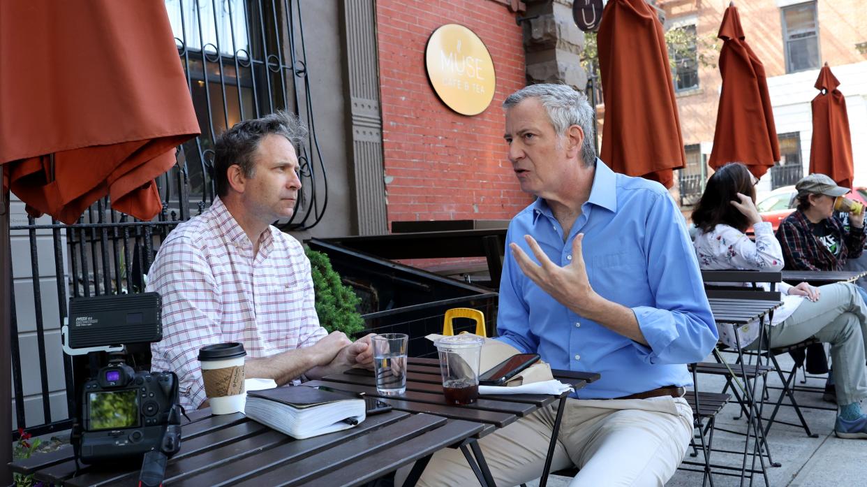 Former New York City Mayor Bill de Blasio (right) is pictured during an interview with City Hall reporter Michael Gartland (left) at the Muse Café in Park Slope, Brooklyn, New York on Monday, May 23, 2022. 