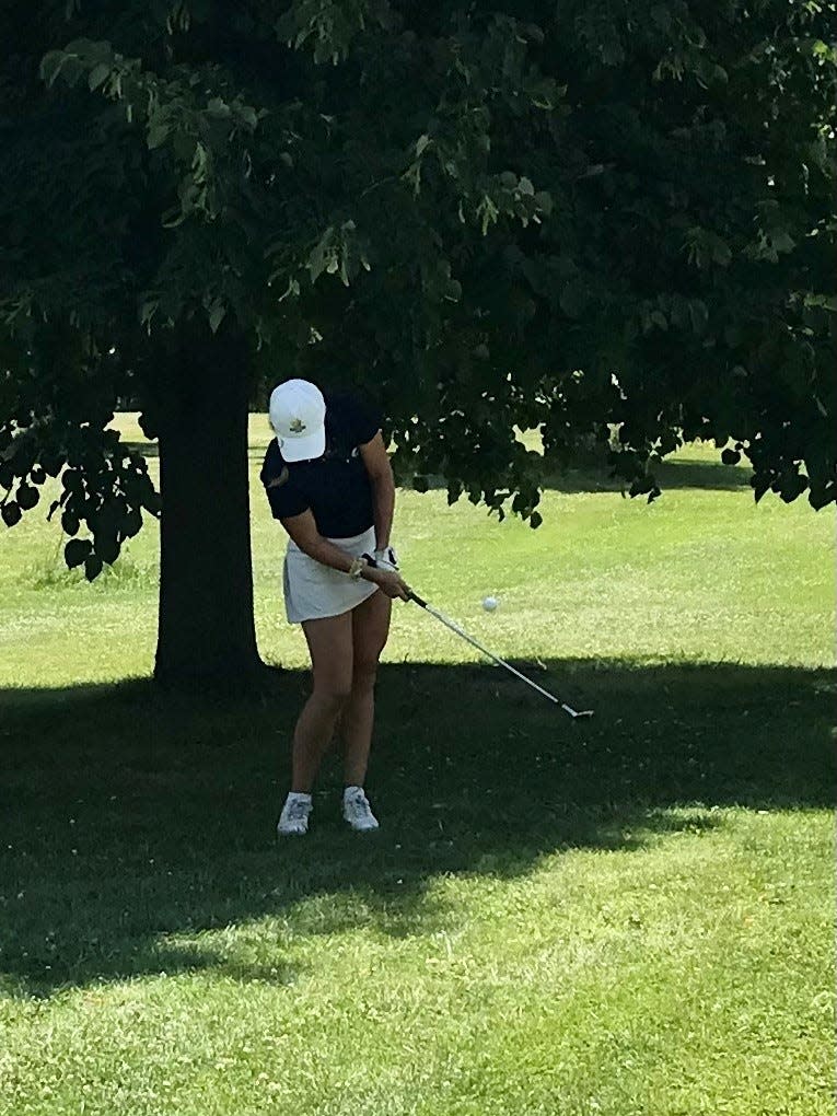 A competitor in the 46th annual Ohio Junior Girls Championship chips her ball onto the green during Tuesday's final round at the Marion Country Club.