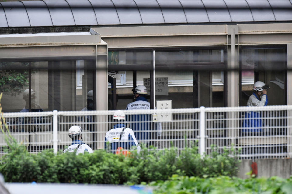 <p>Rescuers enter Tsukui Yamayuri-en, a facility for the handicapped where a number of people were killed and dozens injured in a knife attack Tuesday, July 26, 2016, in Sagamihara, outside Tokyo. (Kyodo News via AP)</p>