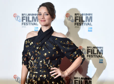 Marion Cotillard poses as she arrives for the gala screening of the film "Its only the end of the world" , during the 60th British Film Institute (BFI) London Film Festival at Leicester Square in London, Britain October 14, 2016. REUTERS/Hannah McKay