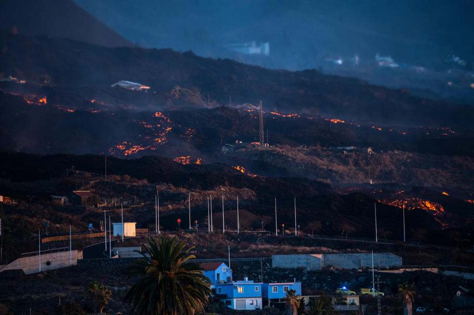 LA PALMA, SPAIN - 2021/10/11: Lava streams from the Cumbre Vieja Volcano passing near residential houses. Cumbre Vieja Volcano continues erupting lava with new streams reaching industrial and residential areas. (Photo by Marcos del Mazo/LightRocket via Getty Images)