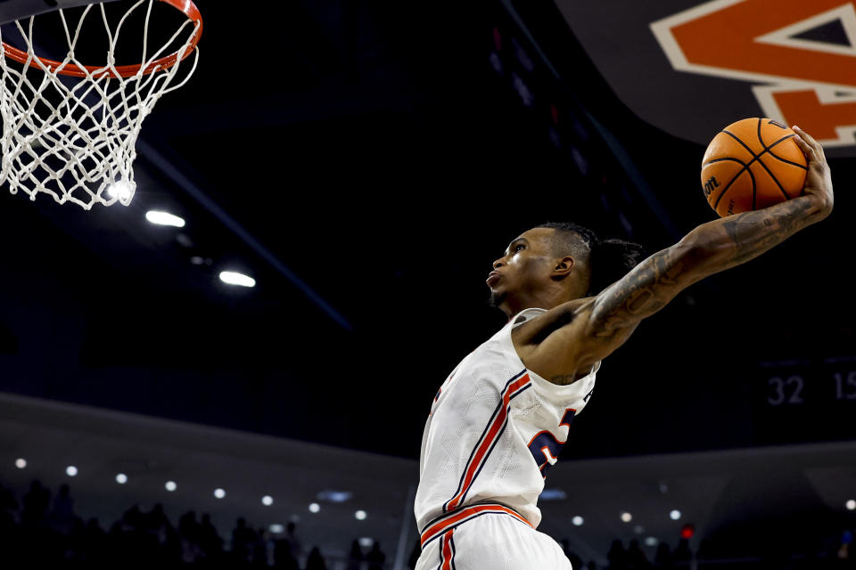 Auburn guard Allen Flanigan goes up for a dunk after being fouled during the second half of an NCAA college basketball game against Tennessee Saturday, March 4, 2023, in Auburn, Ala. (AP Photo/Butch Dill)