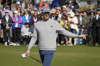 Aaron Rogers urges his ball to the left during the putting challenge event of the AT&T Pebble Beach Pro-Am golf tournament in Pebble Beach, Calif., Wednesday, Feb. 1, 2023. (AP Photo/Eric Risberg)