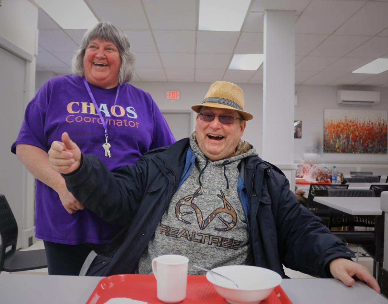 Romero House executive director Evelyn McNulty and Carl Sabean, who's been coming to the Saint John soup kitchen for 20 years.  (Julia Wright/CBC  - image credit)