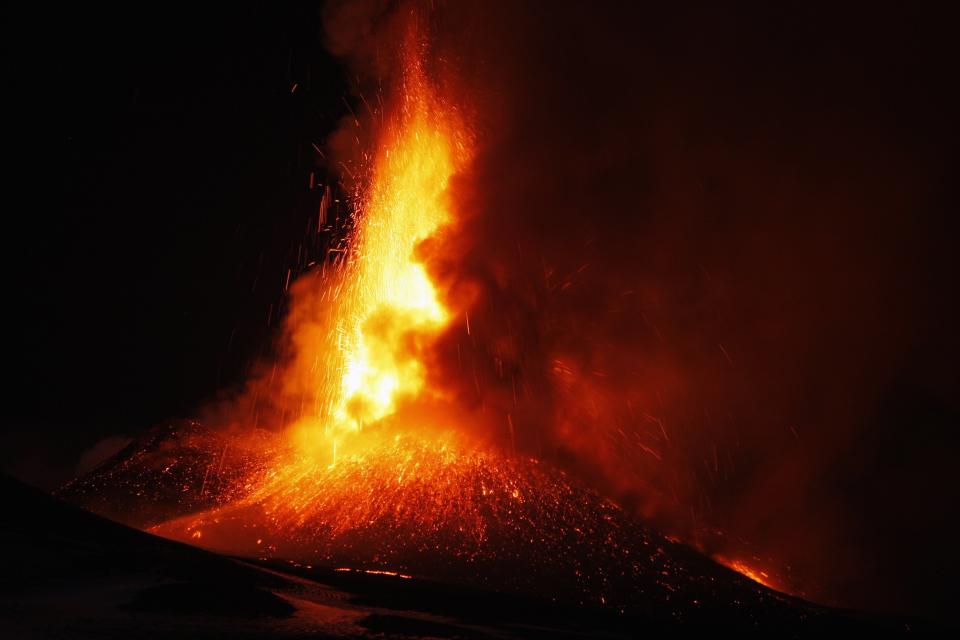 Italy's Mount Etna, Europe's tallest and most active volcano, spews lava as it erupts on the southern island of Sicily November 17, 2013. There were no reports of damage or evacuations in the area and the nearby airport of Catania was operating as normal, local media reported. It is the 16th time that Etna has erupted in 2013. The south-eastern crater, formed in 1971, has been the most active in recent years. REUTERS/Antonio Parrinello (ITALY - Tags: ENVIRONMENT SOCIETY)