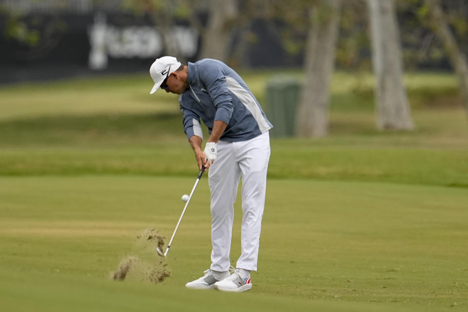 Rickie Fowler hits from the fairway on the second hole during the first round of the U.S. Open golf tournament at Los Angeles Country Club on Thursday, June 15, 2023, in Los Angeles. (AP Photo/George Walker IV)