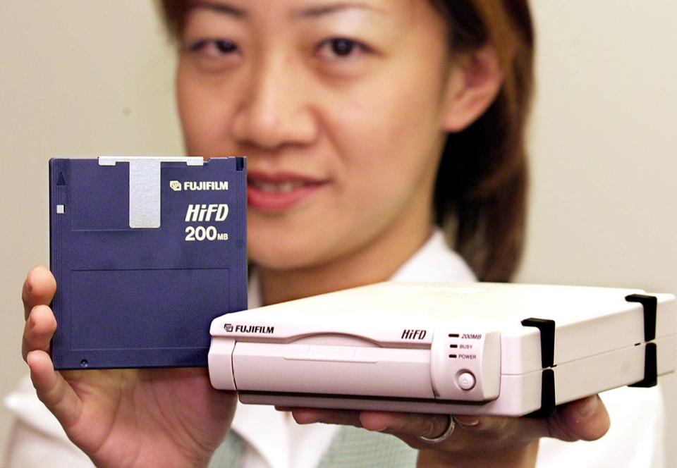 A file photo shows a woman holding a new Fujifilm 200MB capacity 3.5