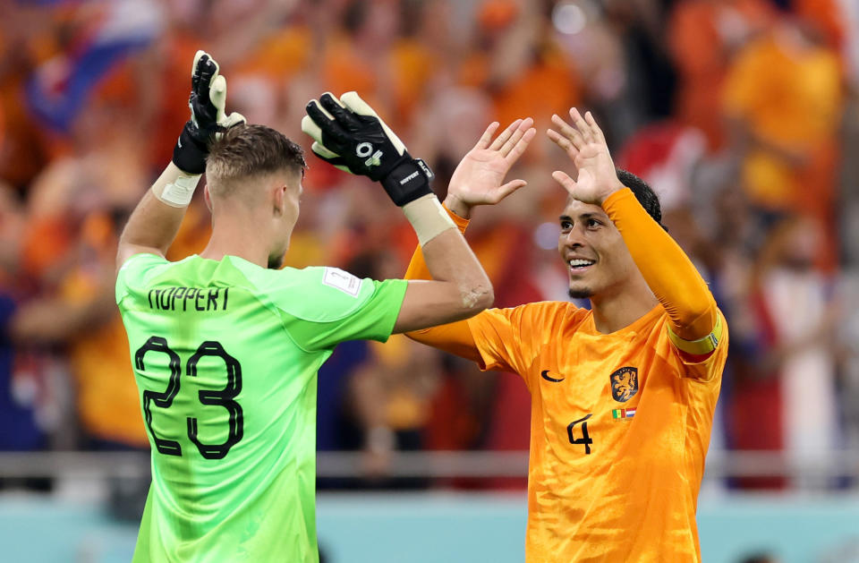 Andries Noppert L, goalkeeper of the Netherlands, celebrates with Virgil van Dijk after winning the Group A match between Senegal and the Netherlands at the 2022 FIFA World Cup at Al Thumama Stadium in Doha, Qatar, Nov. 21, 2022. (Photo by Li Gang/Xinhua via Getty Images)