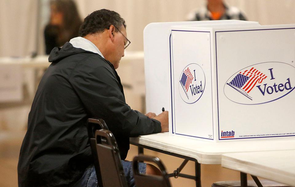 John Saccomen casts his ballot at the Mozelle Hall polling place Tuesday, May 3, 2022. TOM E. PUSKAR/TIMES-GAZETTE.COM